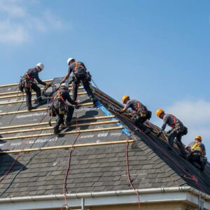 Professional roofing team performing emergency repairs on a residential roof